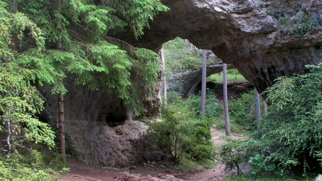 Les Arcs de Saint Pierre on the Causse Méjean. Limestone arch on a hiking trail called Le sentier des Arcs Saint Pierre.