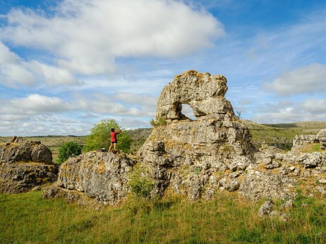 Someone photographs a rock at Chaos de Nîmes-le-Vieux on the Causse Méjean
