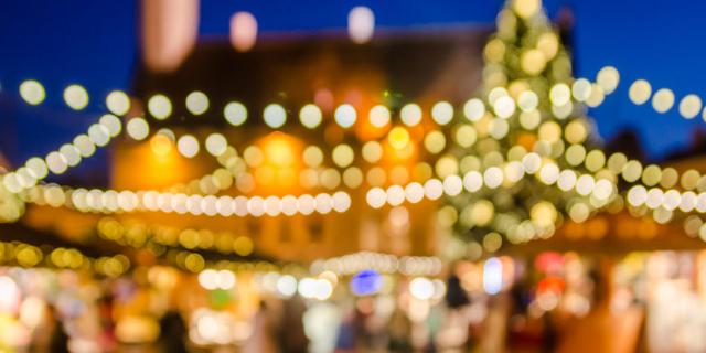 56075127 - decorated christmas market. abstract blurred lights background