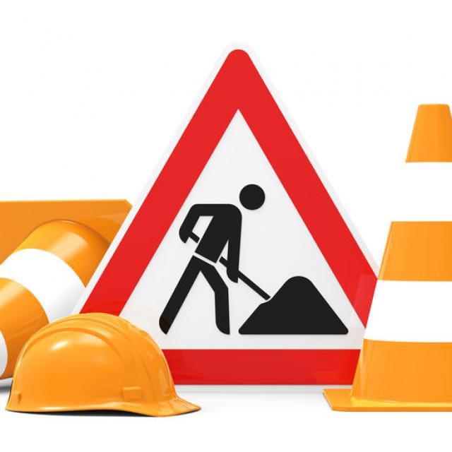 Under construction, road sign, traffic cones and safety helmet, isolated on white background 3D rendering