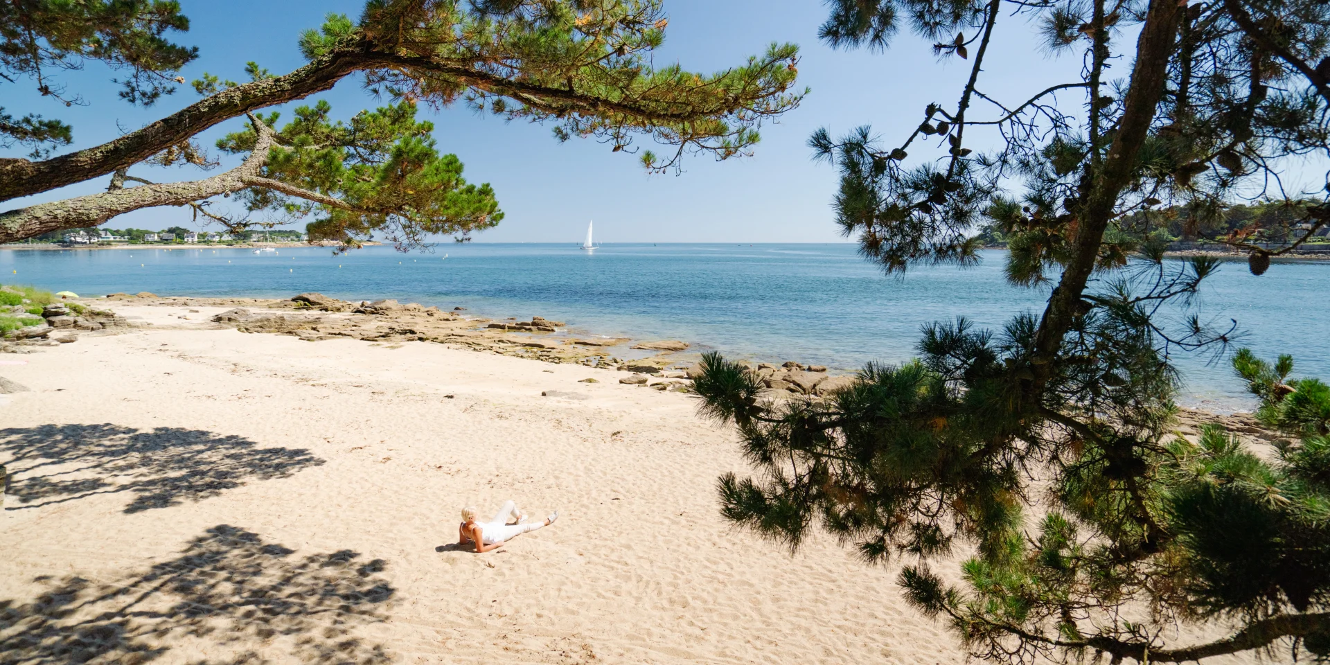 Woman sunbathing on Plage du Coq