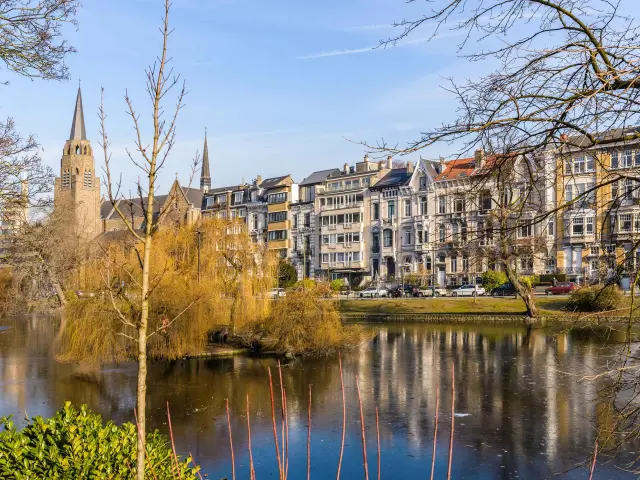 View of Ixelles ponds with buildings and nature in Brussels