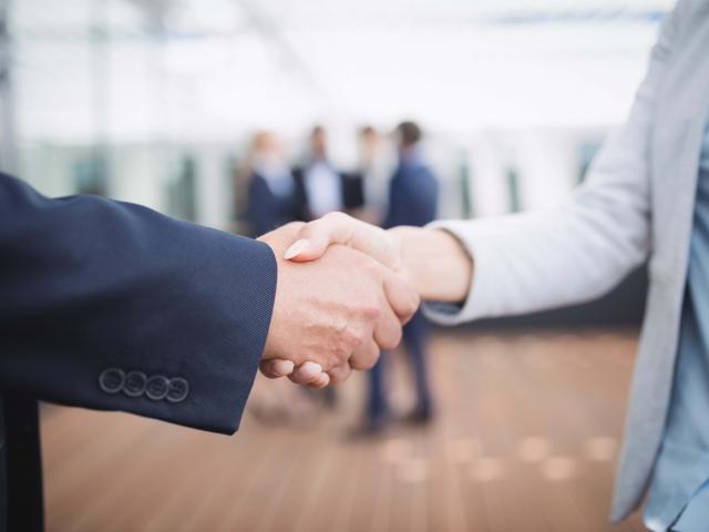Close-up of businesspeople shaking hands