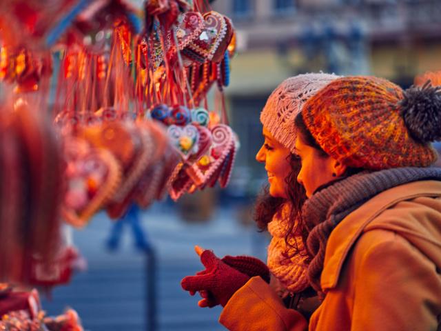 Friends Buying Candies On Christmas Market