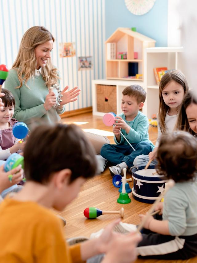 Parents taking part in the activities for preschool children. Healthy learning environment. Teacher and parents working together.