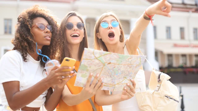 Tourists in cities with a map