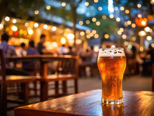 Bokeh background of street bar beer restaurant, outdoor. People