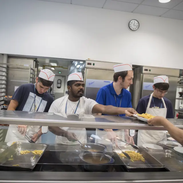 The volunteer catering team serves meals
