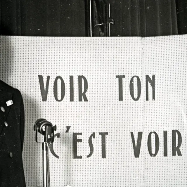 Rodhain in front of a sign, to see your brother is to see your God