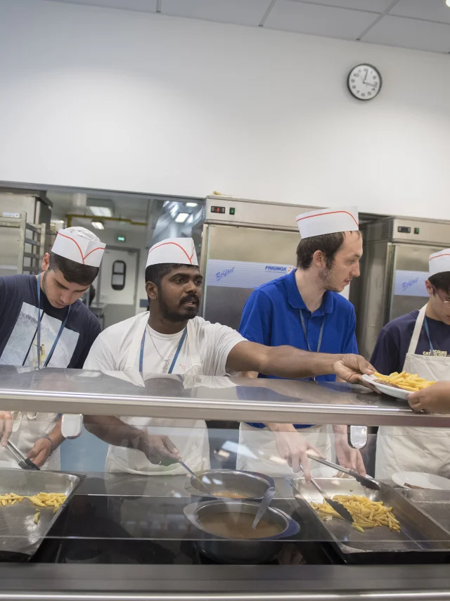 The volunteer catering team serves meals