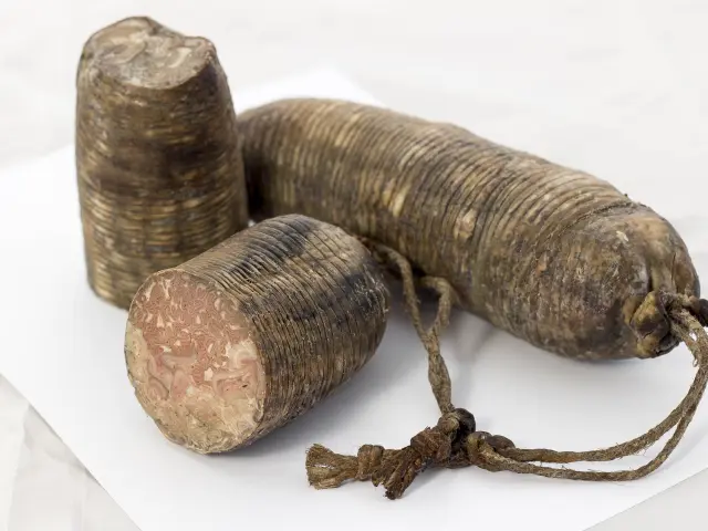 Three artisanal sausages with strings