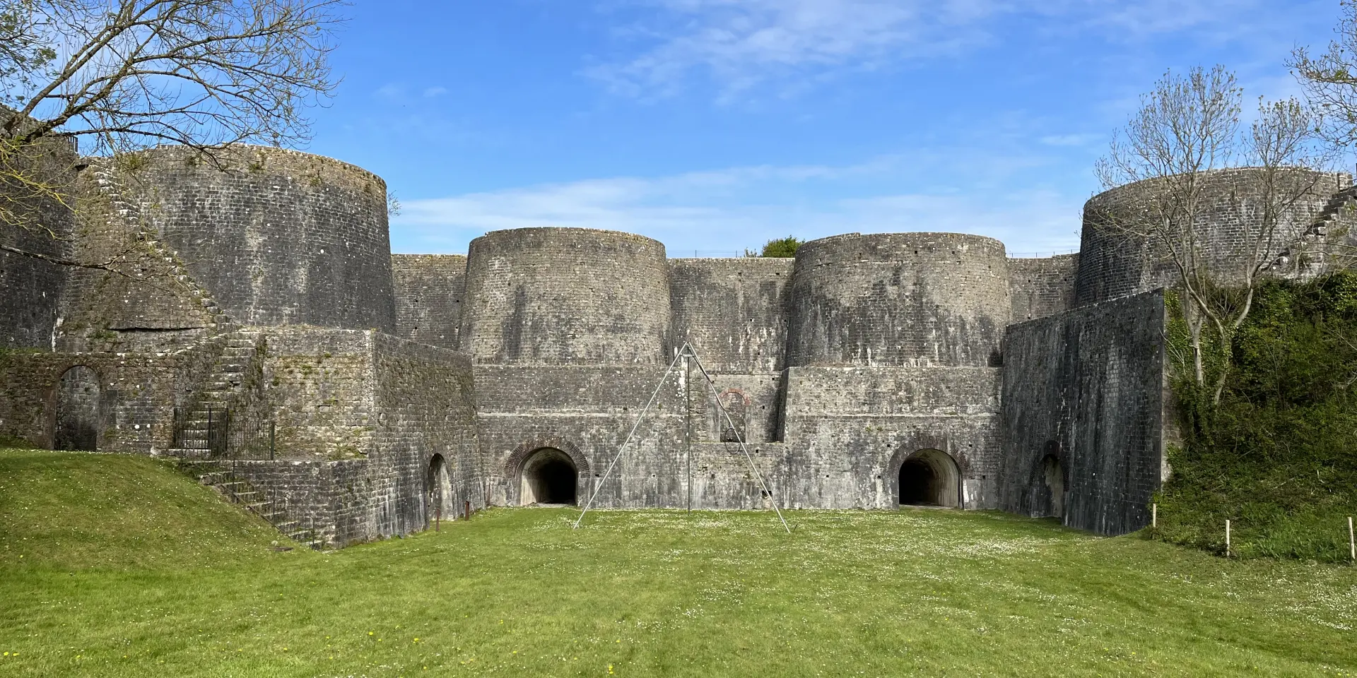 Medieval fortress ruins with three stone towers