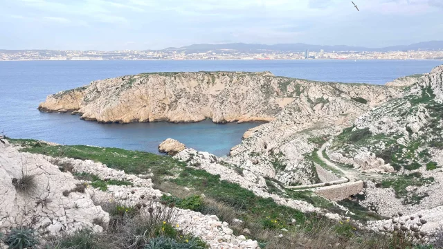 View of a path on the Frioul islands with the sea and the Côte Bleue in the background