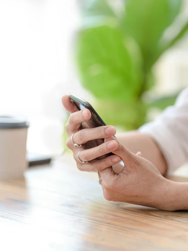 Close up. Woman hand using smartphone order goods online.
