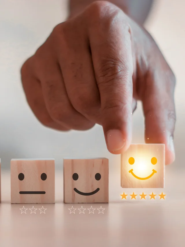 customer services best excellent business rating experience. Satisfaction survey concept. Hand of a businessman chooses a smiley face on wood block cube. 5 Star Satisfaction