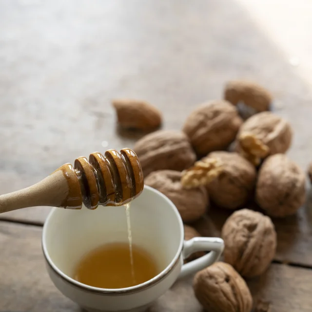 Local honey in front of nuts
