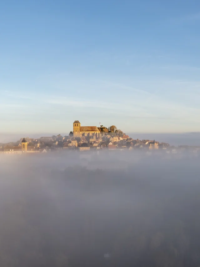 Early morning view of Gourdon from a drone in the mist