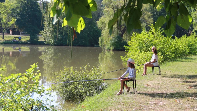 Two little girls in a nature fishing workshop