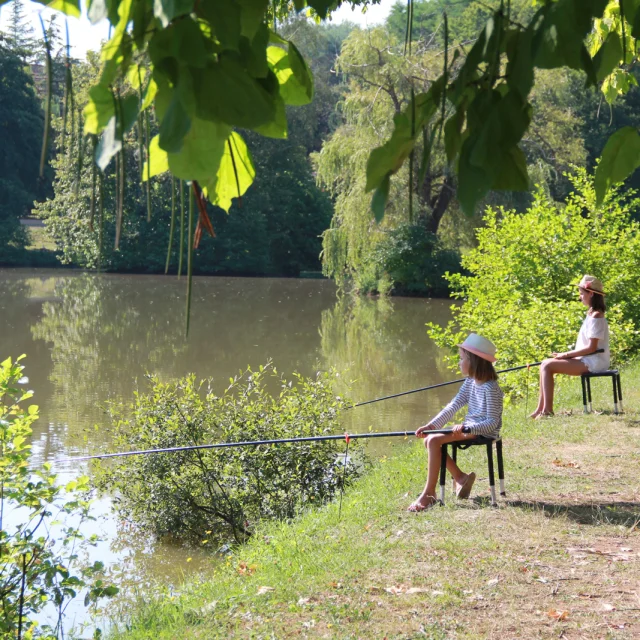 Two little girls in a nature fishing workshop