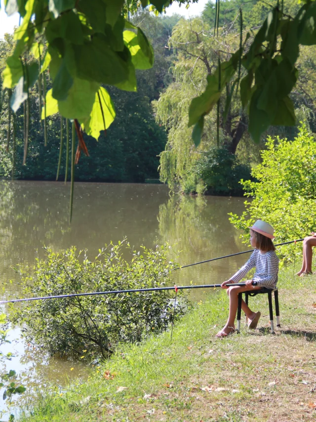 Two little girls in a nature fishing workshop