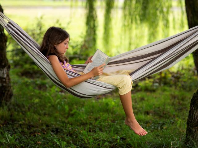 full-cut-girl-reading-in-hamac