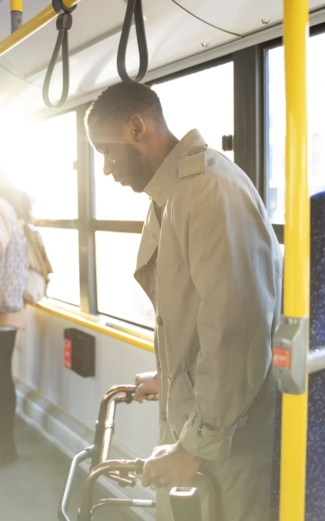 Medium Shot Man With Walking Frame Traveling By Bus
