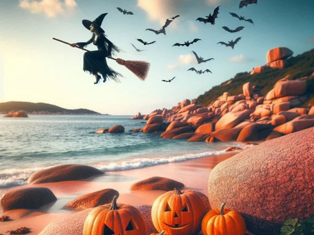Un sorcière et des chauves-souris volent au dessus d'une plage de la Côte de Granit Rose et des citrouilles style Jack O'Lanternes sont posées sur le sable