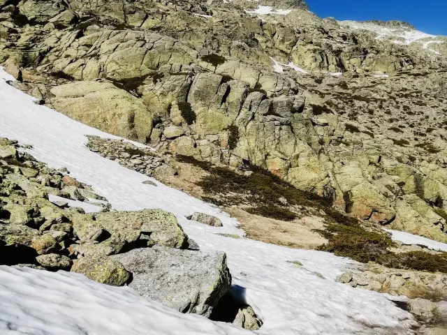 The mesmerizing view of the Penalara mountain in Spain covered in snow on a sunny day
