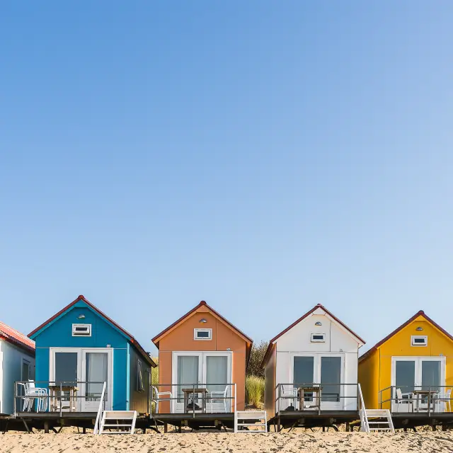 A wide angle shot of Camping De Nolle in Vlissingen, Netherlands under a blue sky