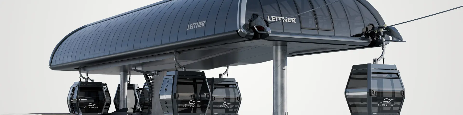 Maquette de la gare de télécabine du Jas à Superdévoluy avec cabines vitrées noires sous un large auvent métallique.