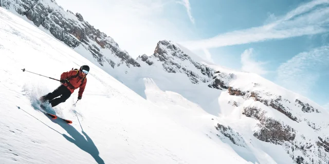 A skier makes his tracks in virgin powder snow below mont charvet