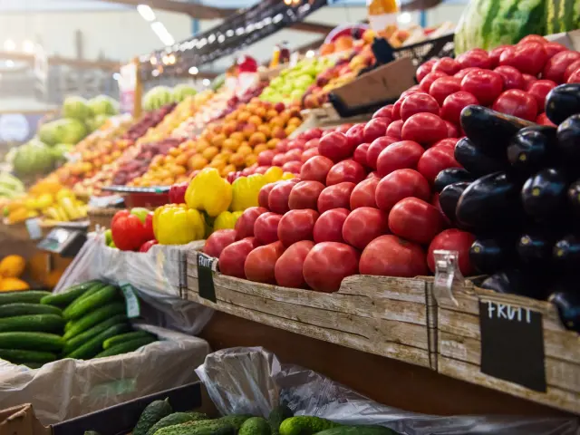 Vegetable farmer market counter: colorful various fresh organic healthy vegetables at grocery store. Healthy natural food concept