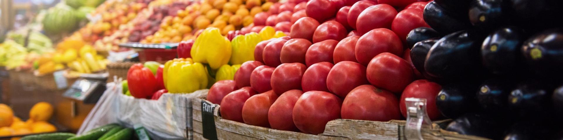 Vegetable farmer market counter: colorful various fresh organic healthy vegetables at grocery store. Healthy natural food concept