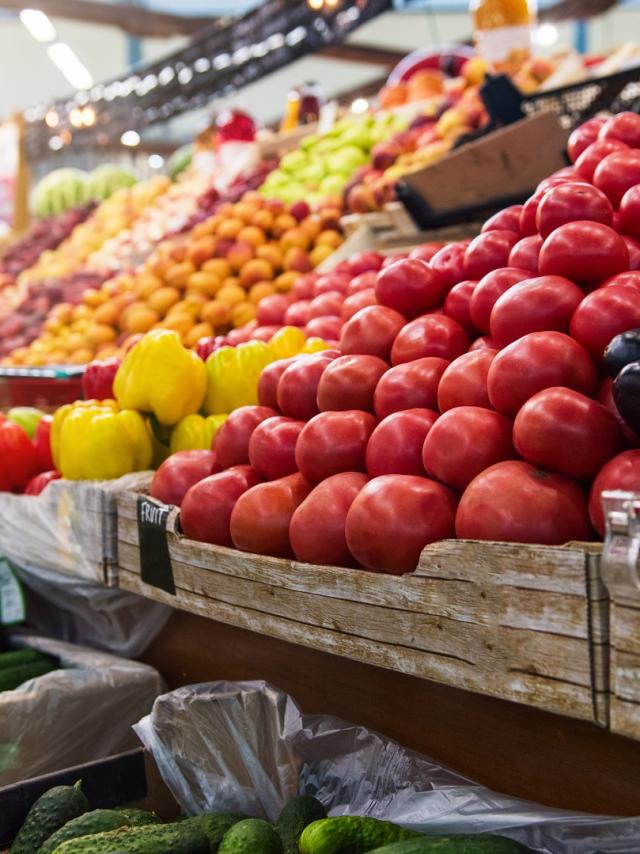 Vegetable farmer market counter: colorful various fresh organic healthy vegetables at grocery store. Healthy natural food concept