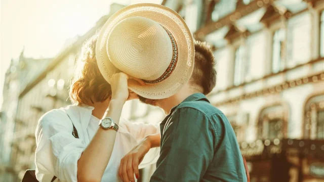 Romantic youth concept. Young stylish hipster couple in love at the city.