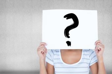 Woman With Sign In The Face With Question Mark (1)