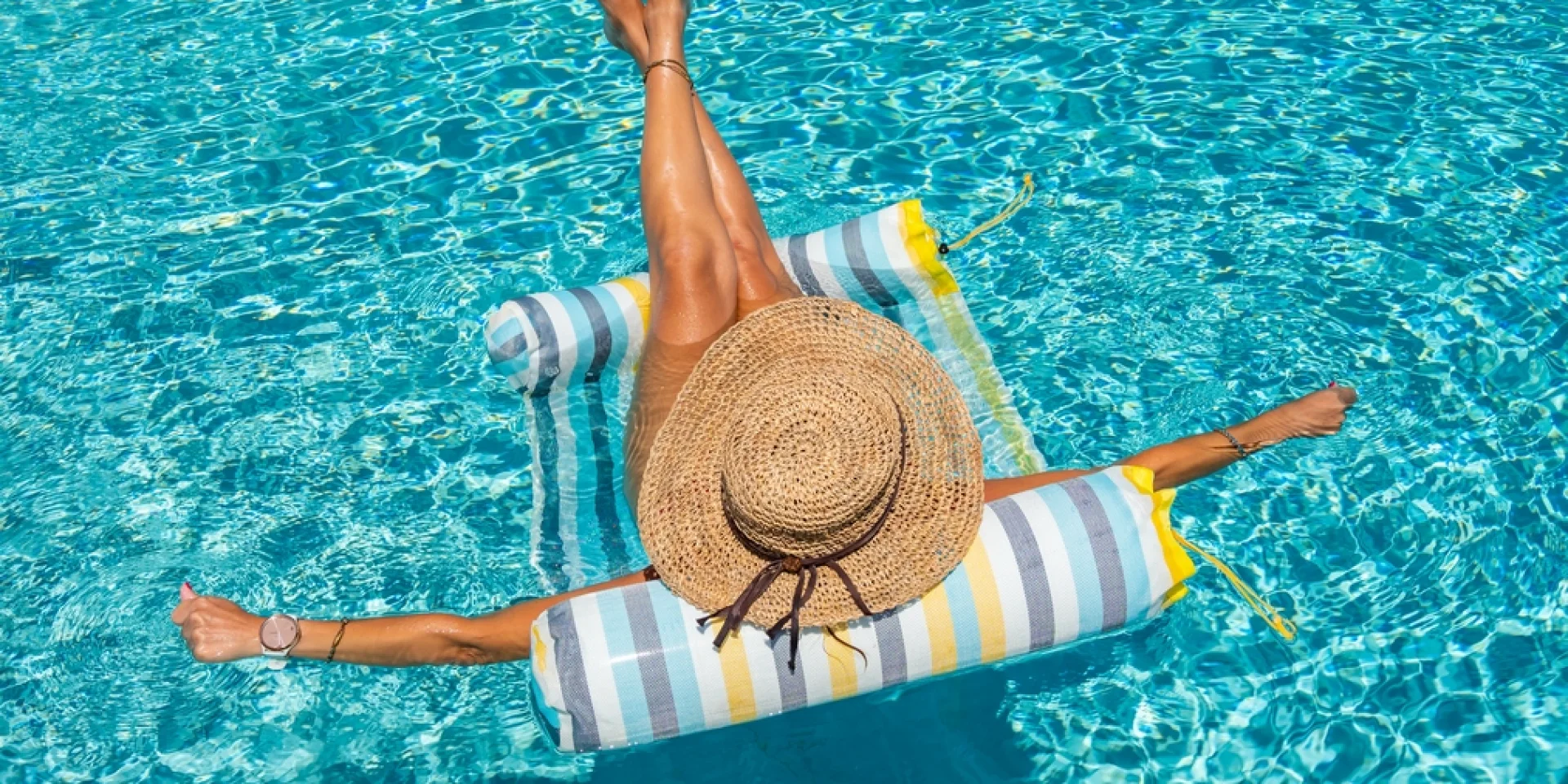 woman in luxury five stars spa resort in the swimming pool.