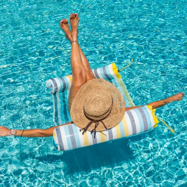 woman in luxury five stars  spa resort in the swimming pool.