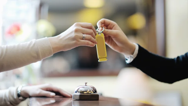 business woman  at the reception of a hotel checking in