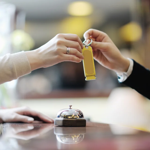 business woman  at the reception of a hotel checking in