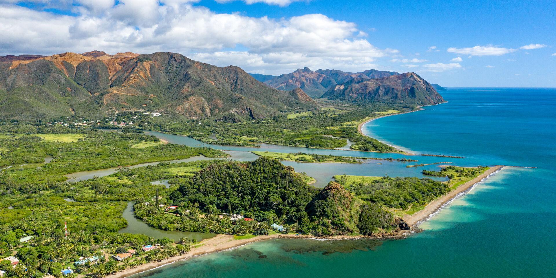 Aerial view of the commune of Thio, New Caledonia, overlooking the Bota Méré lookout, the village and the mountains.