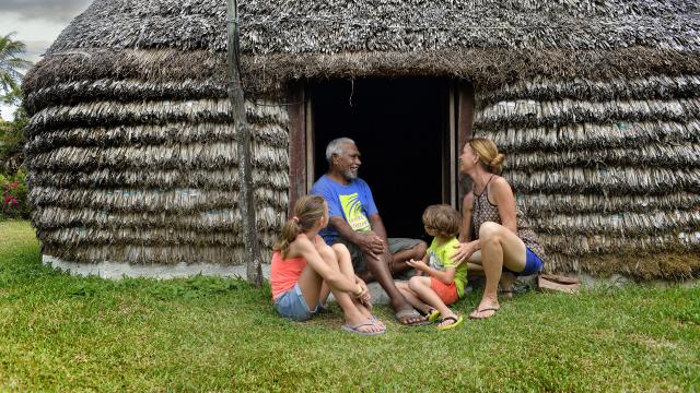 A tourist family on a tribe in Lifou, New Caledonia's Loyalty Islands.