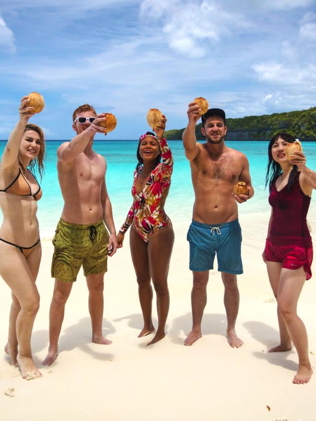 Enjoying a coconut on Kiki beach in Lifou