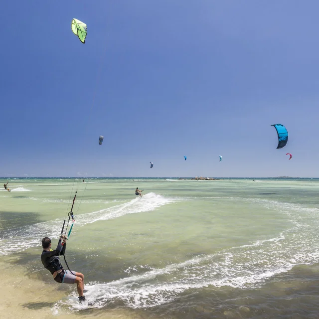 Kitesurfing on the Meridien beach at Anse-Vata, Noumea