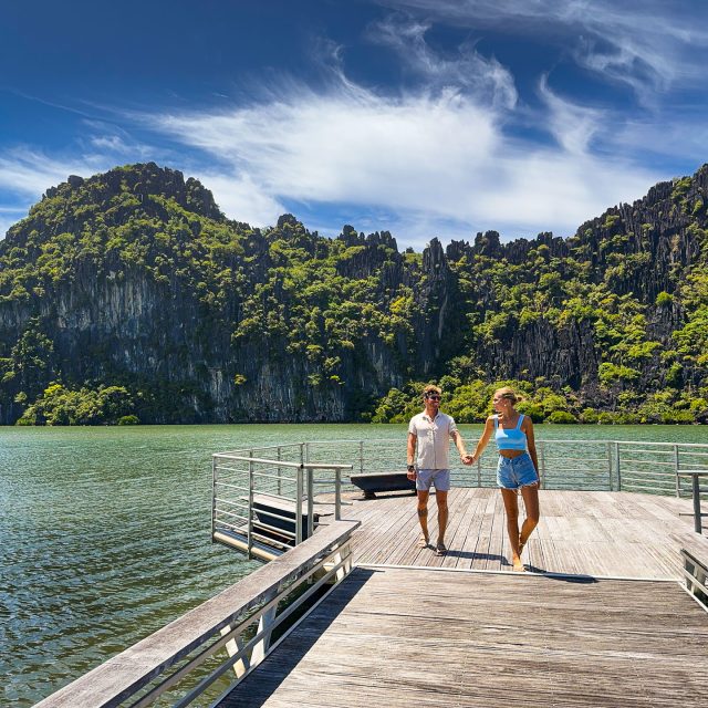 Couple holding hands at the Linderalic Cliffs in Hienghène
