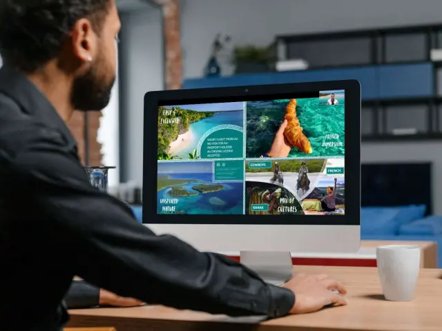 A participant attends a New Caledonia webinar on a desktop screen showing a presentation with destination visuals.