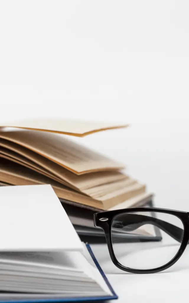 close-up-open-books-with-glasses.jpg