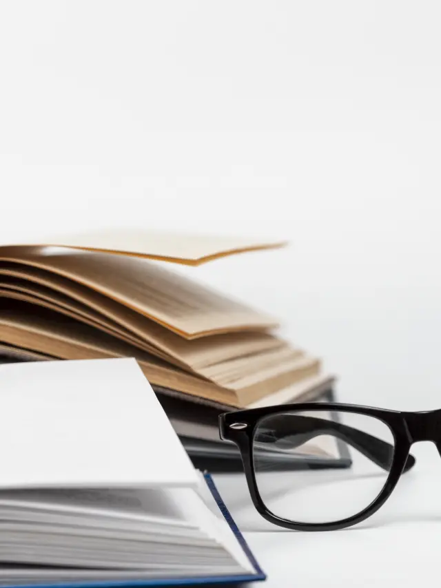 close-up-open-books-with-glasses.jpg