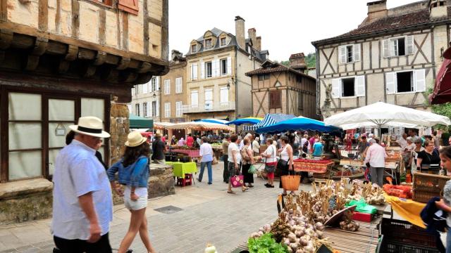 Fruit Stall With People Buying At Morlaix Weekly Market France