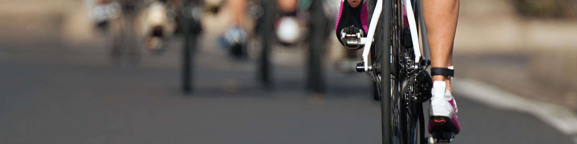 Cycling competition cyclist athletes riding a race at high speed